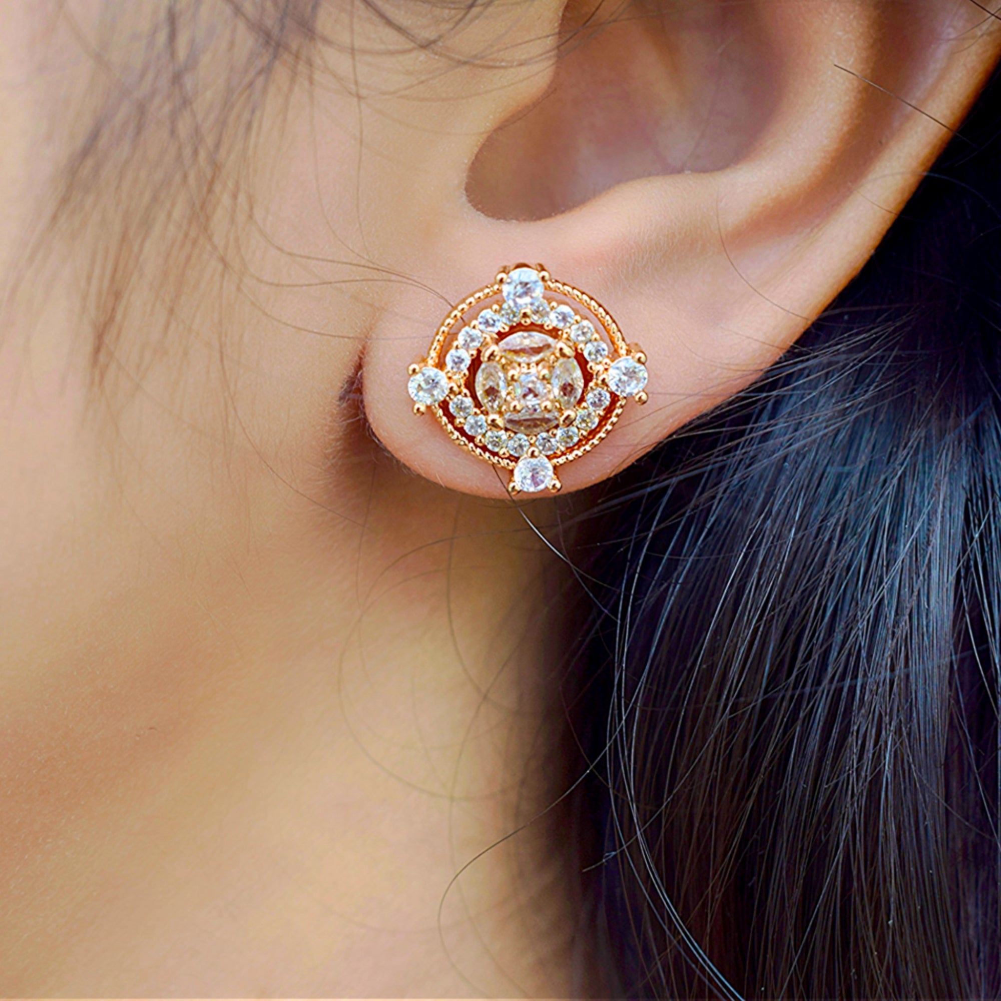 close up of a girl wearing Round Gold zirconia stoned earring