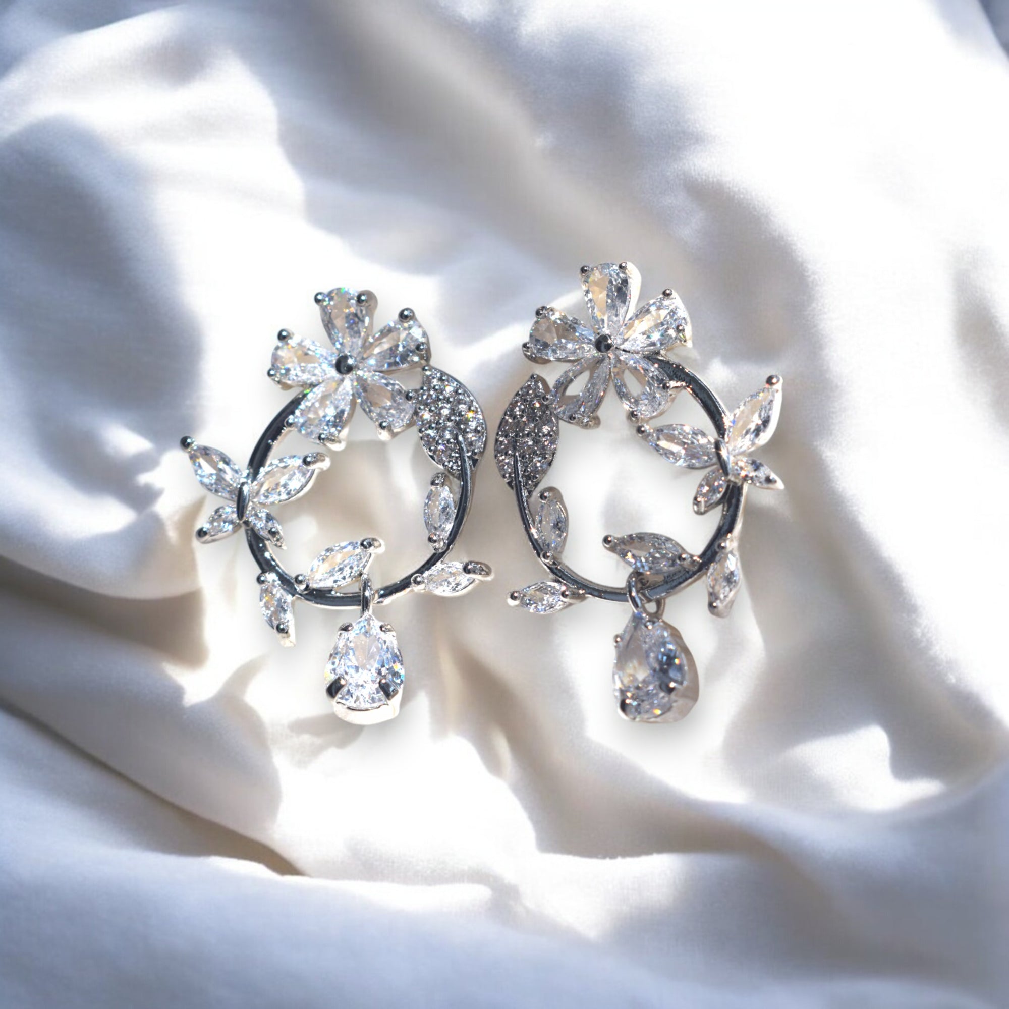 Silver floral hoop earrings with Zirconia crystal petals and teardrop gemstone, inspired by cherry blossoms 