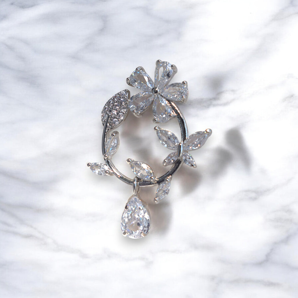 Silver floral hoop earrings with Zirconia crystal petals and teardrop gemstone, inspired by cherry blossoms 