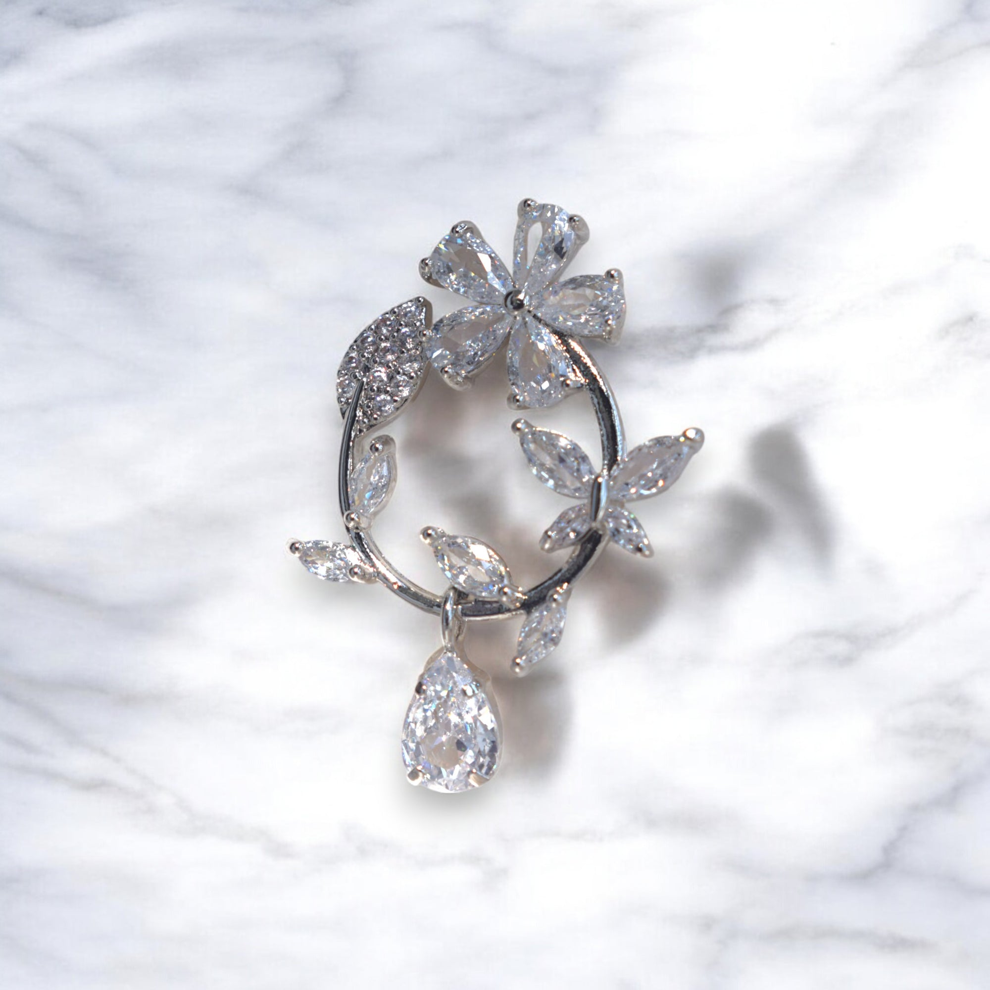 Silver floral hoop earrings with Zirconia crystal petals and teardrop gemstone, inspired by cherry blossoms 