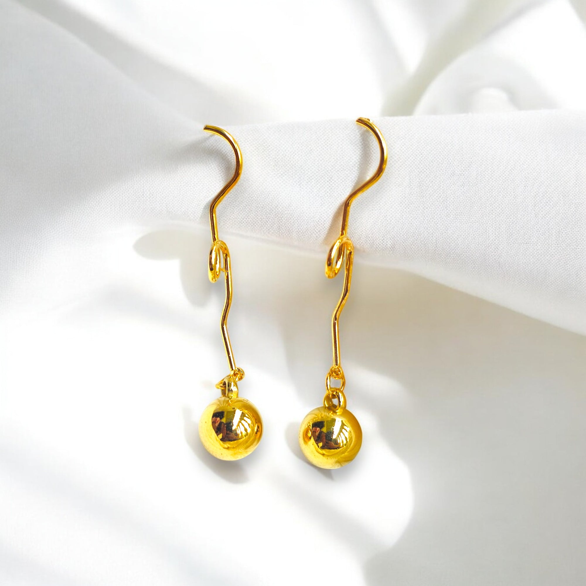 Gold-plated dangle earrings with a minimalist orb design Korean