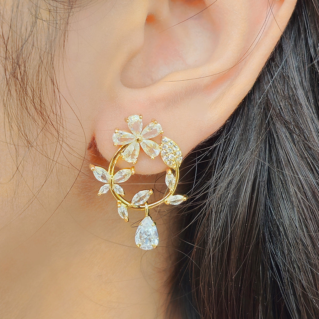 side view of kansobi gold zirconia stone flower bloom earrings 